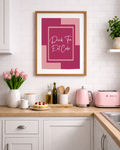 Pink “Drink Tea Eat Cake” kitchen wall art print with modern bold typography, ideal for tea lovers and baking themed kitchen decor.